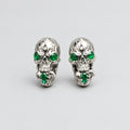 Gothic Skull Stud Earrings, Carved Flame Pattern, Emerald Green Gem Eyes, Ornate Metal Detailing, Dark Occult Statement Earrings